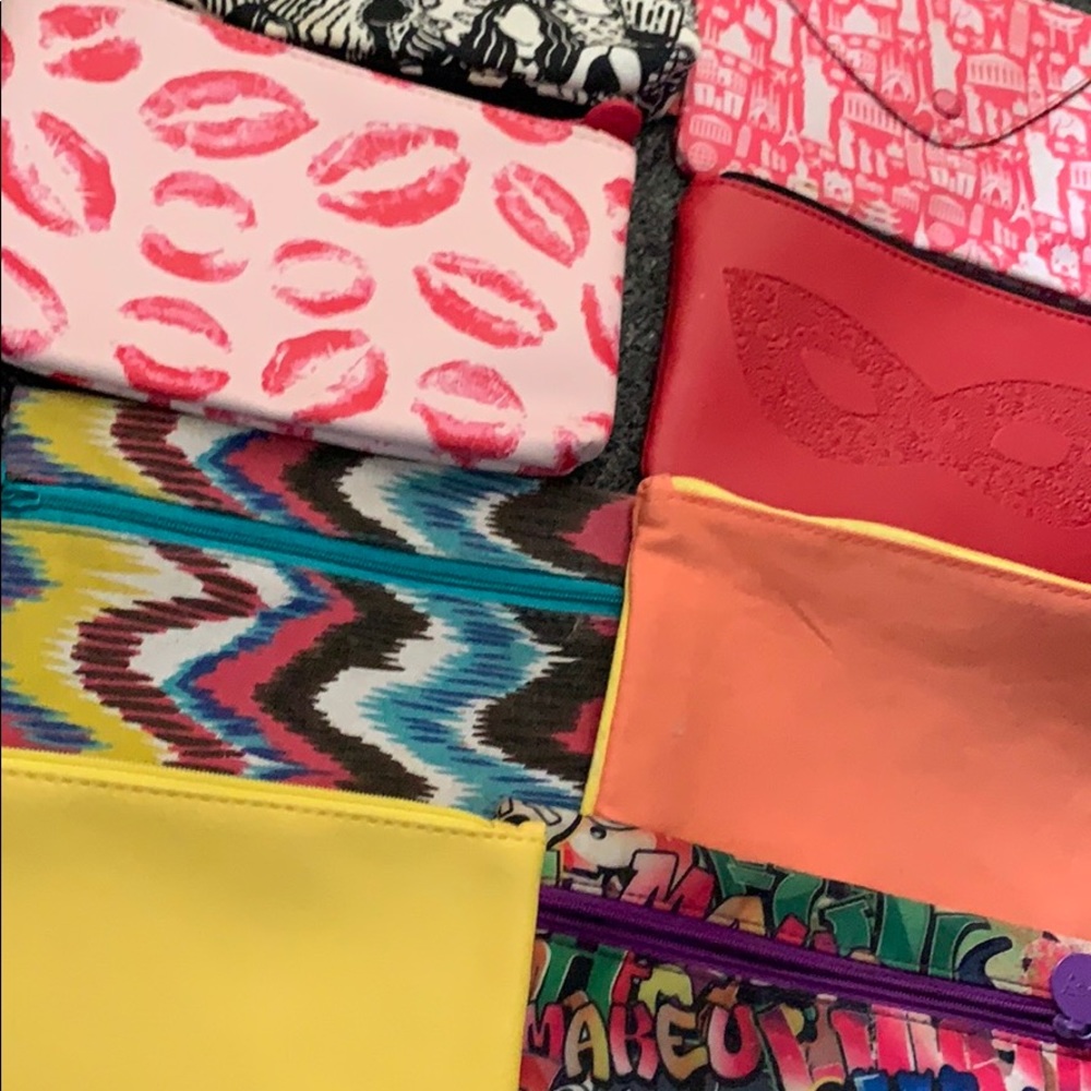 Makeup or wallet bags five bucks each